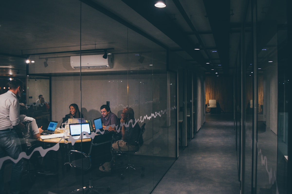 Rocoto Solutions team members collaborating in a meeting